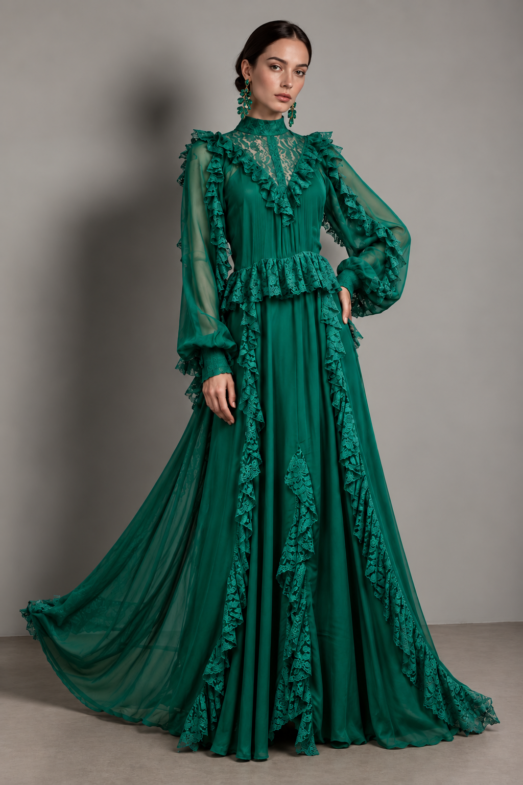 Emerald gown with an illusion lace yoke, a ruffled lace peplum, and cascading lace-trimmed ruffle panels down the skirt.