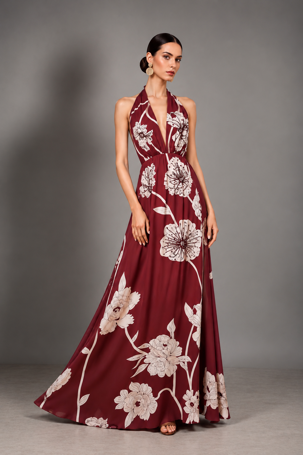 Burgundy and ivory large-scale floral print halter gown with a deep-plunge neckline and beaded floral embroidery at the bodice.